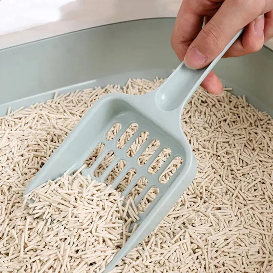 A large, high-quality cat litter scoop made of durable plastic with a hollow design for efficient cleaning.