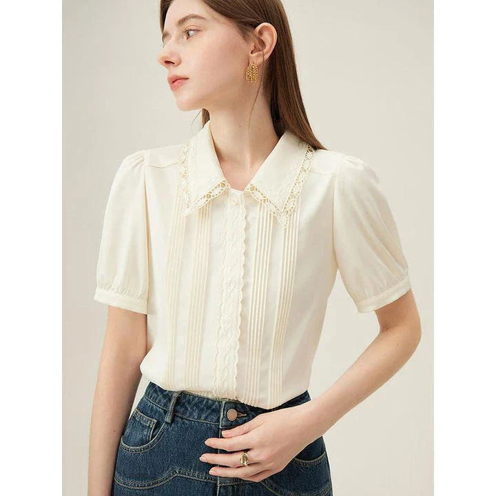 Elegant embroidered polo-neck blouse with petal sleeves, perfect for British summer fashion