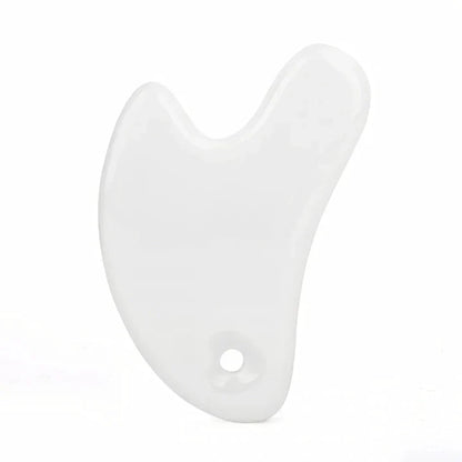 Ceramic Gua Sha facial massager in blue, pink, and white colours, designed to improve circulation and promote lymphatic drainage for radiant, youthful skin.