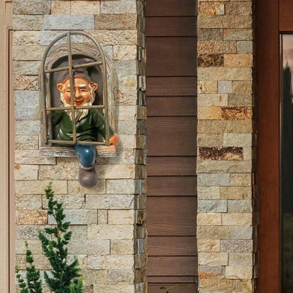 Naughty Elf Out The Door Tree Hugger Garden Statue, a charming resin gnome figure designed to hang on trees or peek out from windows and doors