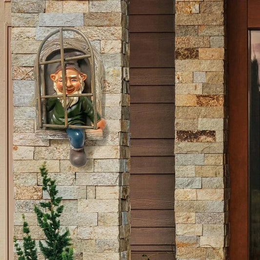 Naughty Elf Out The Door Tree Hugger Garden Statue, a charming resin gnome figure designed to hang on trees or peek out from windows and doors