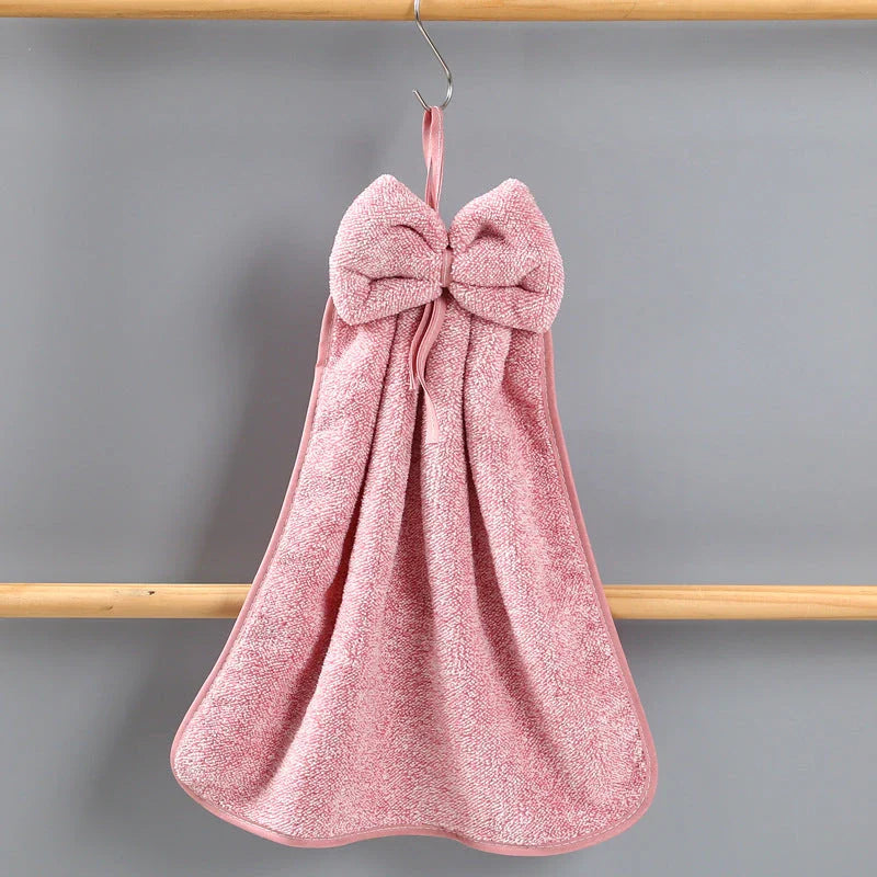 Elegant coral fleece hand towels with a unique bow design, perfect for kitchen and bathroom use