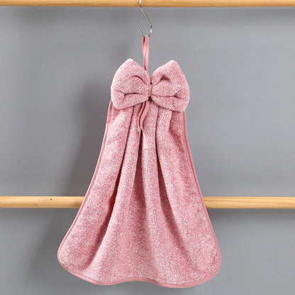 Elegant coral fleece hand towels with a unique bow design, perfect for kitchen and bathroom use