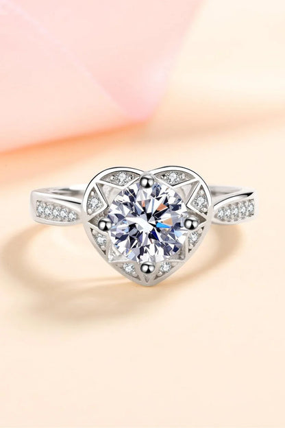 Elegant moissanite heart-shaped ring in sterling silver setting with zircon accent stones