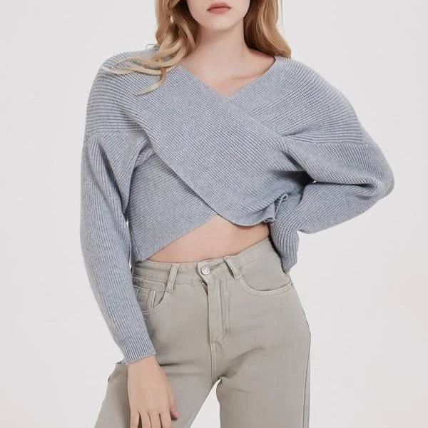A cosy, brown V-neck knitted jumper with a relaxed, comfortable fit and a touch of vintage-inspired style.