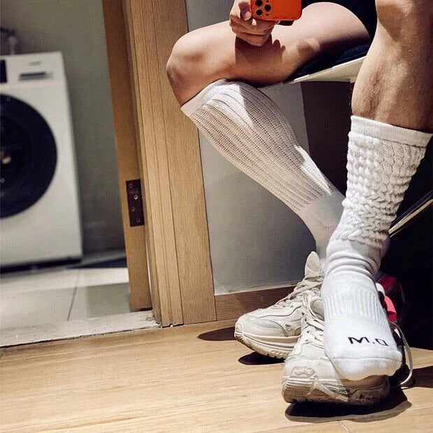 Premium men's breathable terry socks in various solid colours, offering superior moisture-wicking and comfort
