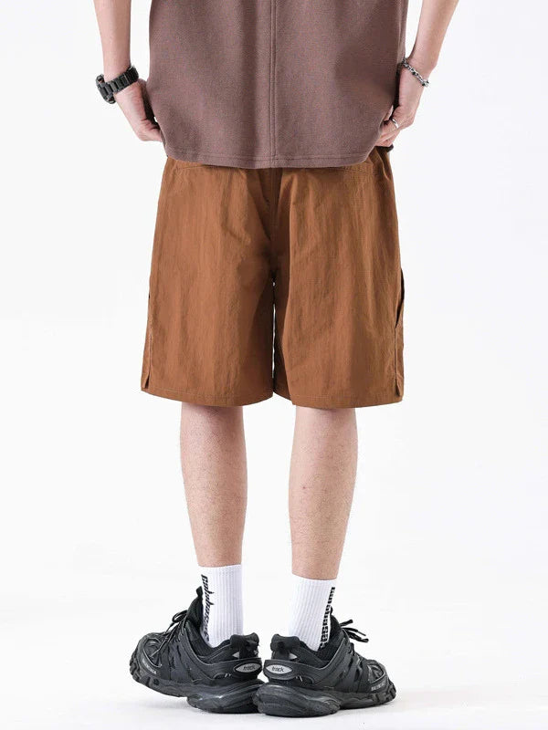 Premium men's quick-drying casual trousers in black, caramel, and sand colours with a relaxed, loose fit