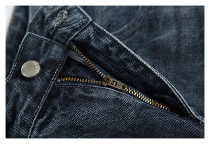A pair of stylish retro-inspired Japanese jeans in black and grey, featuring a mid-rise waist and straight leg silhouette for a flattering, comfortable fit.