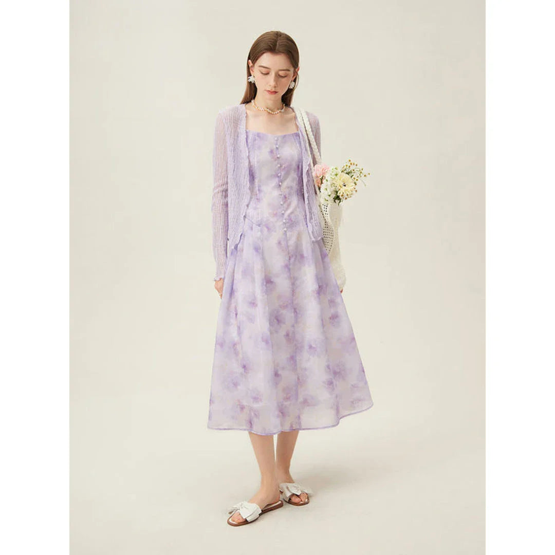 Floral sleeveless summer dress with A-line silhouette and vibrant orange print, perfect for British summer occasions