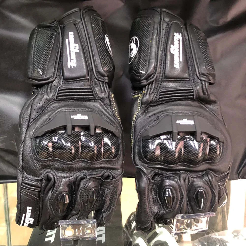 Premium motorcycle gloves made of leather and reinforced with carbon fibre for enhanced protection and breathability