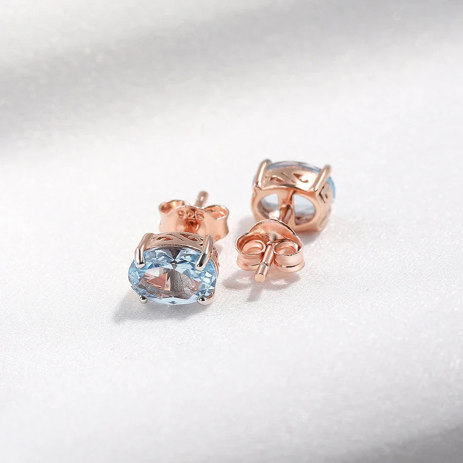Geometrically simple sterling silver earrings in a rose gold finish, showcasing a minimalist and elegant design
