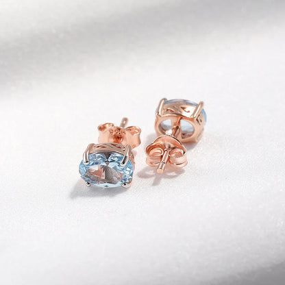 Geometrically simple sterling silver earrings in a rose gold finish, showcasing a minimalist and elegant design