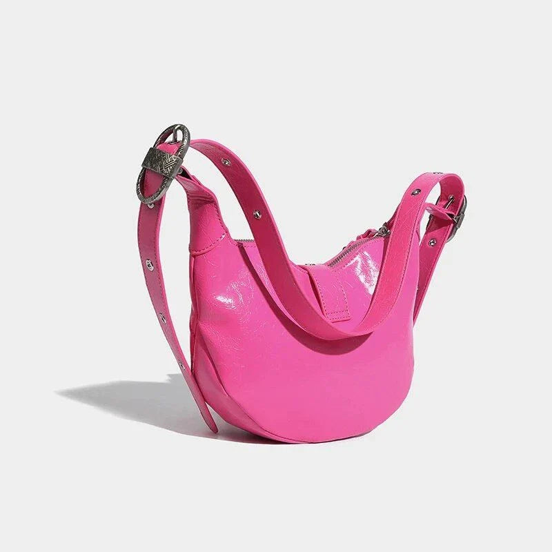 Stylish pink leather sling crossbody daypack with adjustable strap and smooth zipper closure