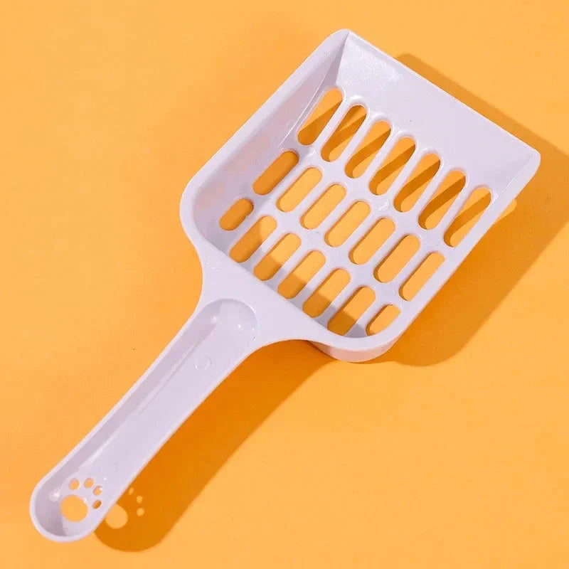 A large, high-quality cat litter scoop made of durable plastic with a hollow design for efficient cleaning.