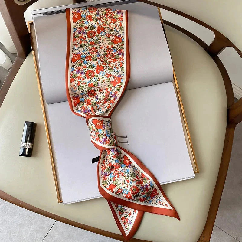 Elegant floral print polyester scarf with a soft, cotton-like texture for versatile seasonal wear