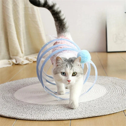 Folding cat play tunnel with various toys like balls, feathers, and mice attached to the sides