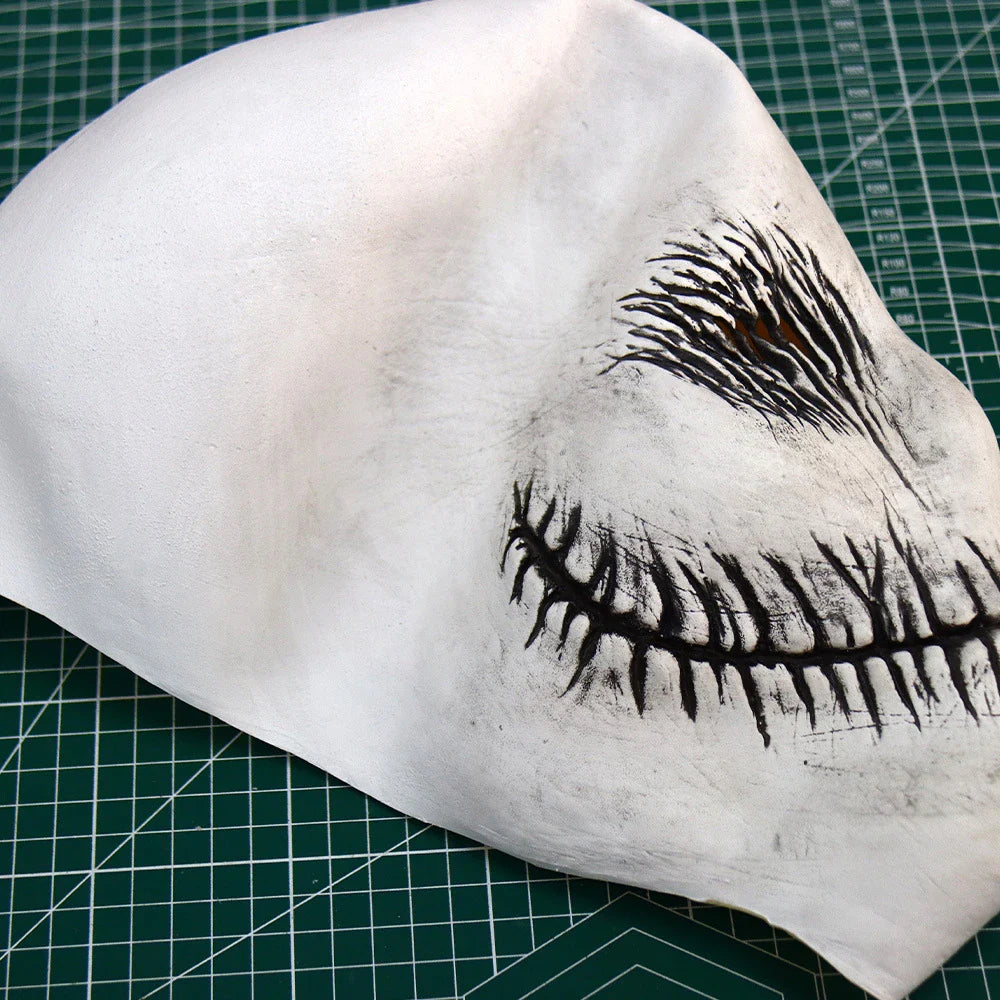 A high-quality latex ghost mask with a chilling and realistic appearance, perfect for Halloween and masquerade parties.