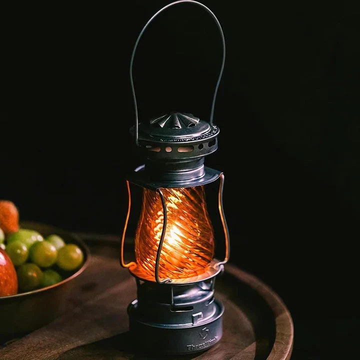 Classic vintage-inspired kerosene camping lamp with stainless steel construction and automatic ignition for reliable outdoor lighting