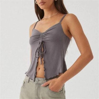 Chic white sleeveless crop top with side bandage detail, perfect for summer fashion