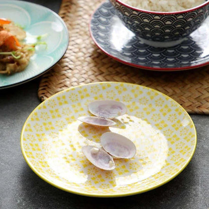 Elegant ceramic plates with vibrant, whimsical prints in a variety of enchanting designs
