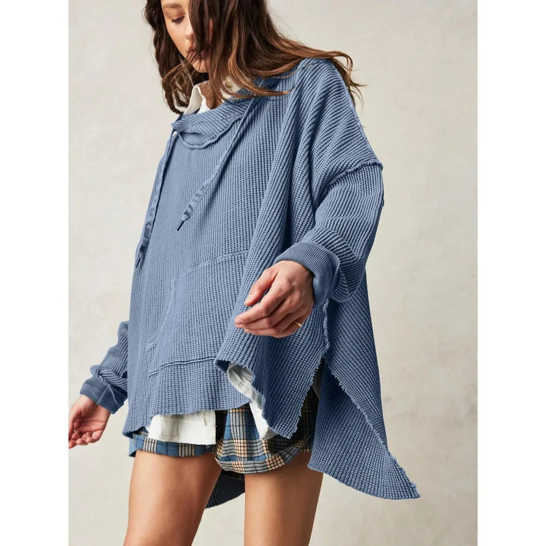 Cosy and stylish oversized hoodie with practical pockets for women, available in black, charcoal grey, and navy blue