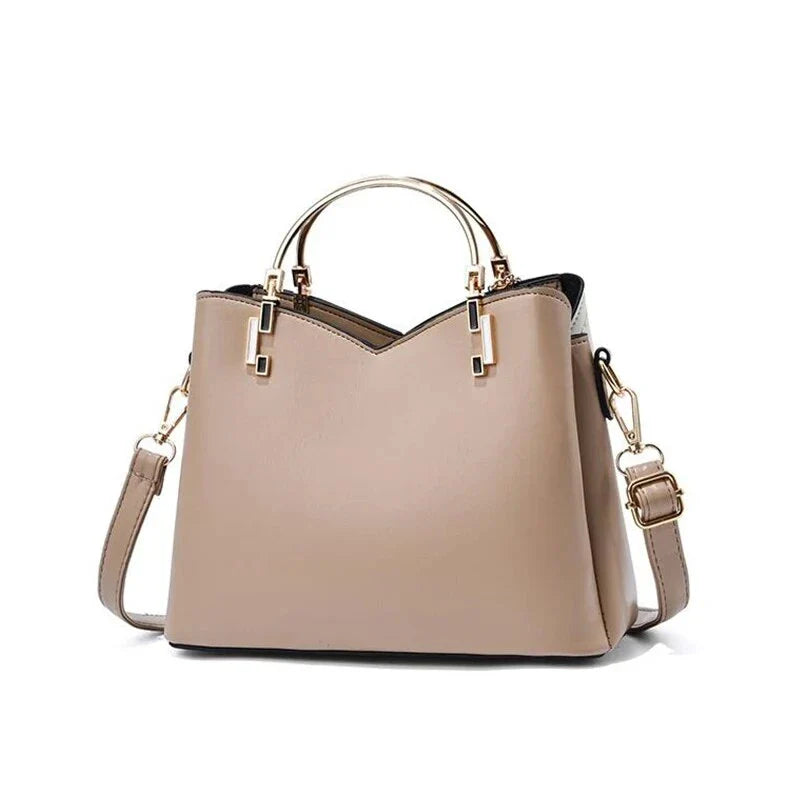 Sophisticated navy blue PU leather bucket crossbody bag with elegant patchwork design and adjustable strap