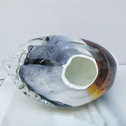 Handcrafted glass ornament in the shape of a Mandarin duck with vibrant colours and intricate details