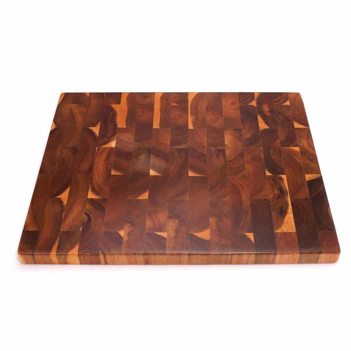 Premium Acacia wood chopping board with a convenient juice groove to catch liquids during food preparation