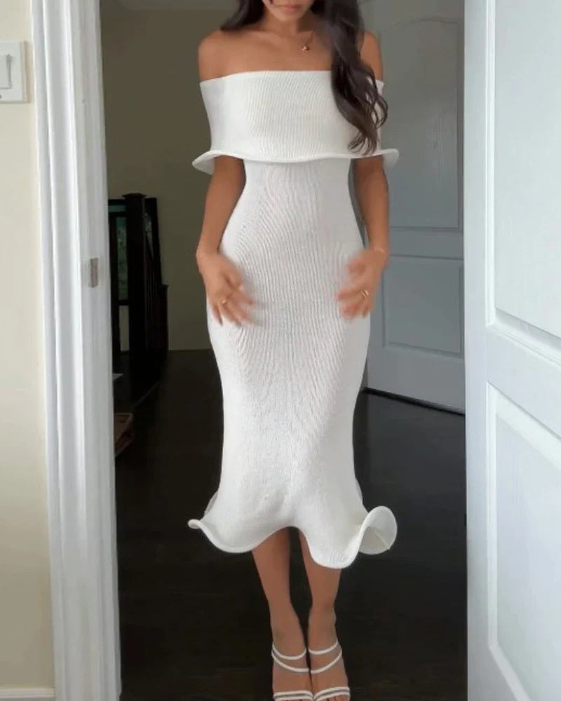 Chic white sleeveless dress with slim-fit silhouette, perfect for stylish occasions in the UK