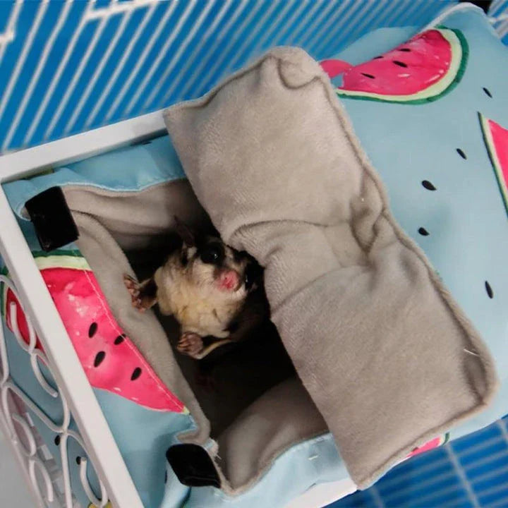 Cosy cotton pet bed in green, providing a plush and supportive sleeping surface for small animals