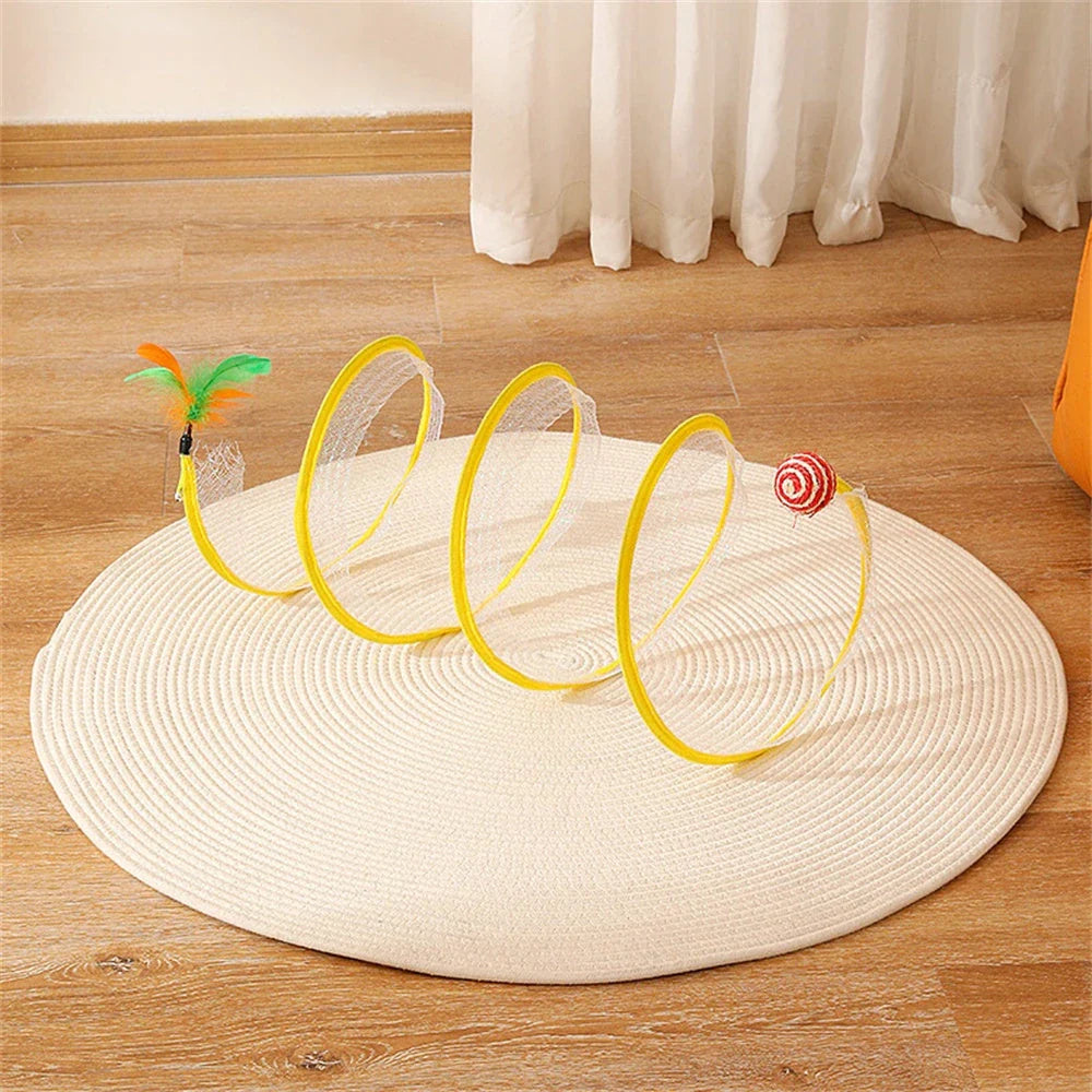 Folding cat play tunnel with various toys like balls, feathers, and mice attached to the sides