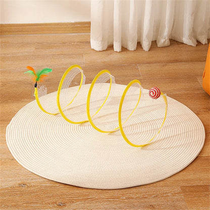 Folding cat play tunnel with various toys like balls, feathers, and mice attached to the sides