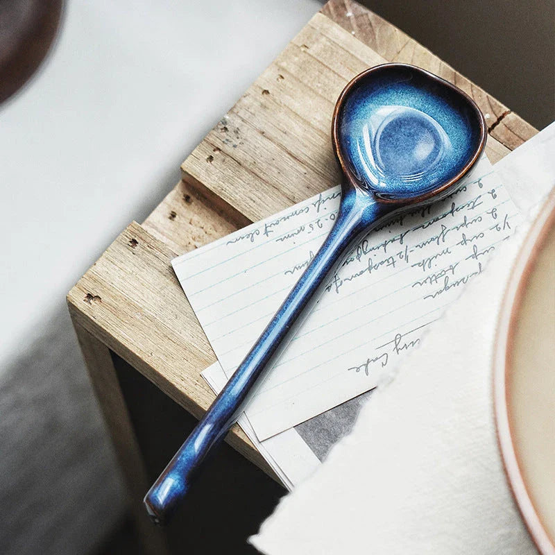 Elegant ceramic soup spoon with long handle and vibrant grey glaze, perfect for refined dining experiences