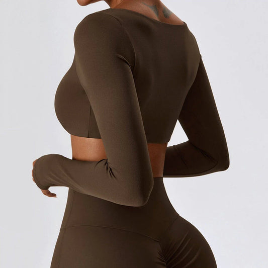 Stylish long sleeve crop top yoga shirt in green, designed for comfort and performance during workouts