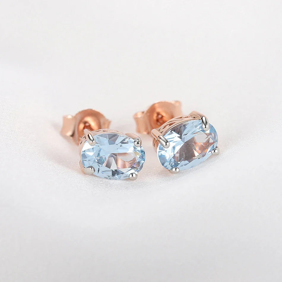 Geometrically simple sterling silver earrings in a rose gold finish, showcasing a minimalist and elegant design