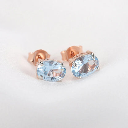 Geometrically simple sterling silver earrings in a rose gold finish, showcasing a minimalist and elegant design
