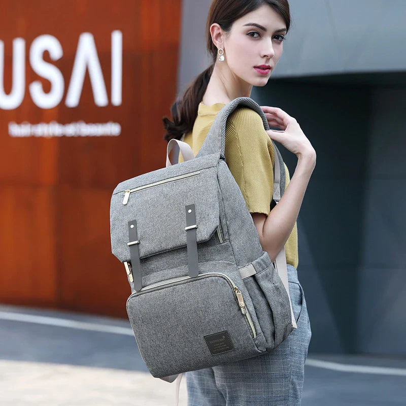A stylish and practical mummy backpack with multiple pockets, perfect for organising and transporting all your parenting essentials.
