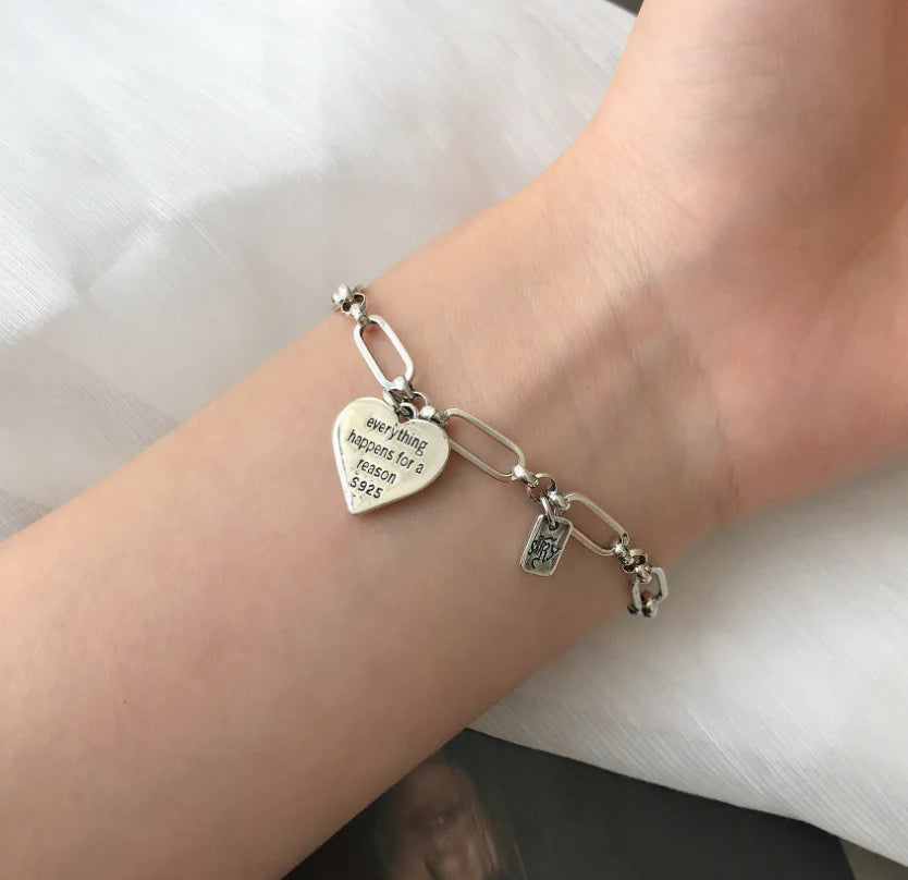 Elegant sterling silver bracelet with a delicate heart charm, a timeless accessory for the modern British woman.