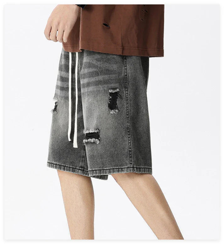 Premium British-crafted vintage-inspired ripped denim shorts for men with a straight-leg silhouette and authentic distressed details