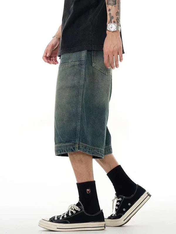 Relaxed-fit men's denim shorts in a vintage blue wash, featuring a wide-leg silhouette and adjustable waistband for maximum comfort.