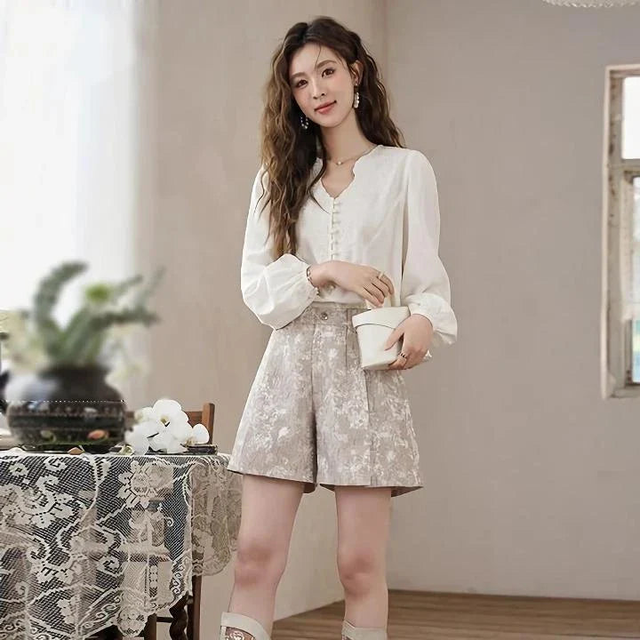 Elegant high-waisted floral jacquard A-line shorts with chic metal buttons, perfect for any occasion
