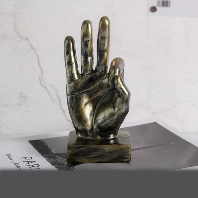 Elegant resin gesture ornaments in a variety of classic bronze and silver finishes, perfect for adding a charming accent to British-inspired home decor
