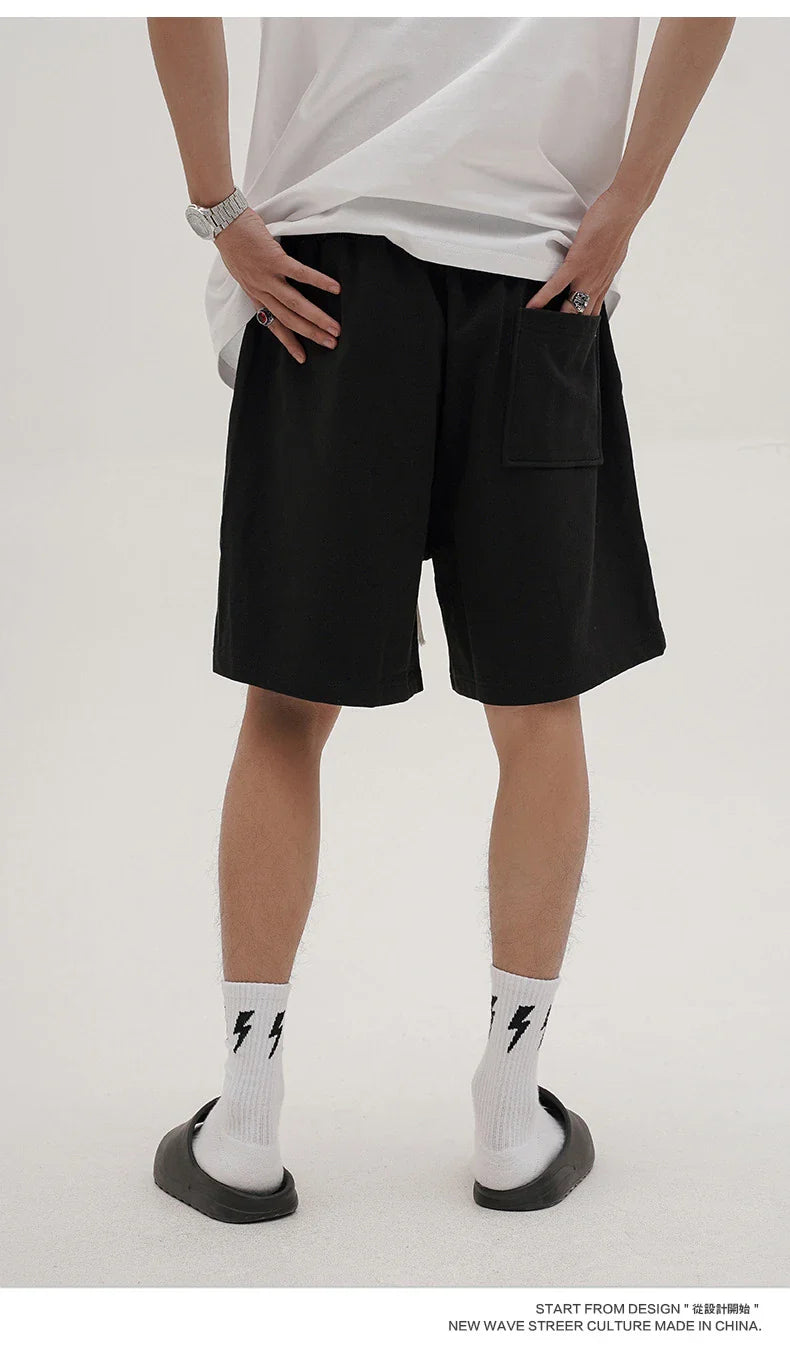 Premium loose-fit sports shorts with eye-catching printed patterns in black, khaki, and dark grey colours