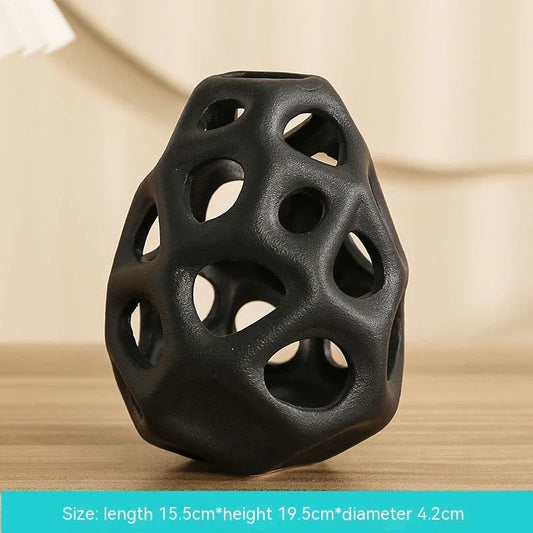 Stylish ceramic decorative balls in geometric design, available in white and black, small and large sizes, for modern home decor