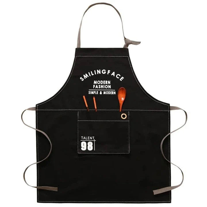 A stylish and practical Nordic-inspired canvas barista apron with a spacious front pocket and adjustable neck strap for a comfortable fit.