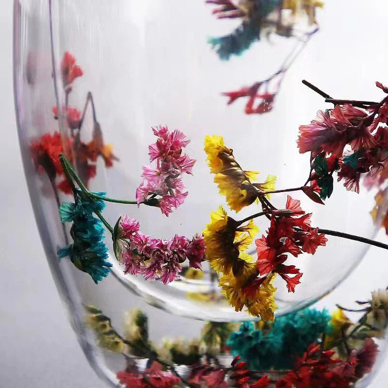 Elegant double-walled glass tea mug with captivating floral display, perfect for hot and cold beverages