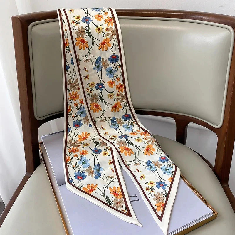 Elegant floral print polyester scarf with a soft, cotton-like texture for versatile seasonal wear