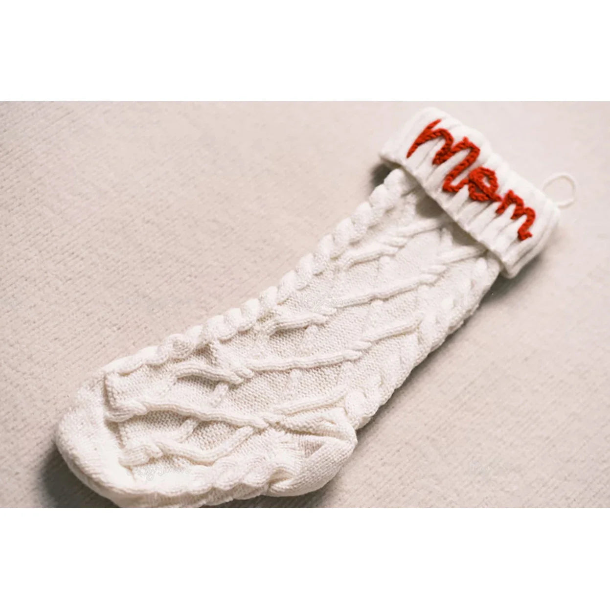 Premium hand-embroidered Christmas socks in a variety of festive colours, featuring intricate machine embroidery for a touch of traditional British charm.