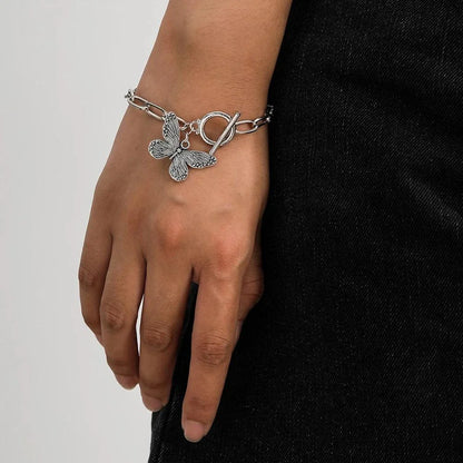 Silver butterfly pendant bracelet with a delicate chain and charming bowknot design
