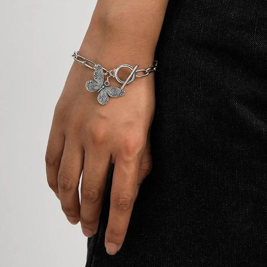 Silver butterfly pendant bracelet with a delicate chain and charming bowknot design